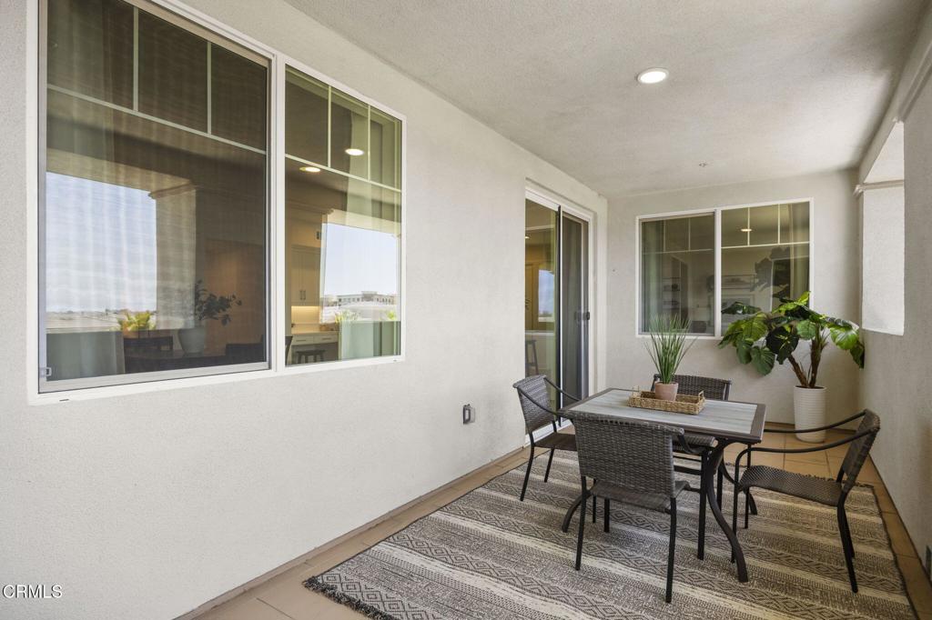 2870 Wagon Wheel Road, Unit 401 Oxnard, CA 93036 - Photo 21 of 49 a dining room with furniture and window