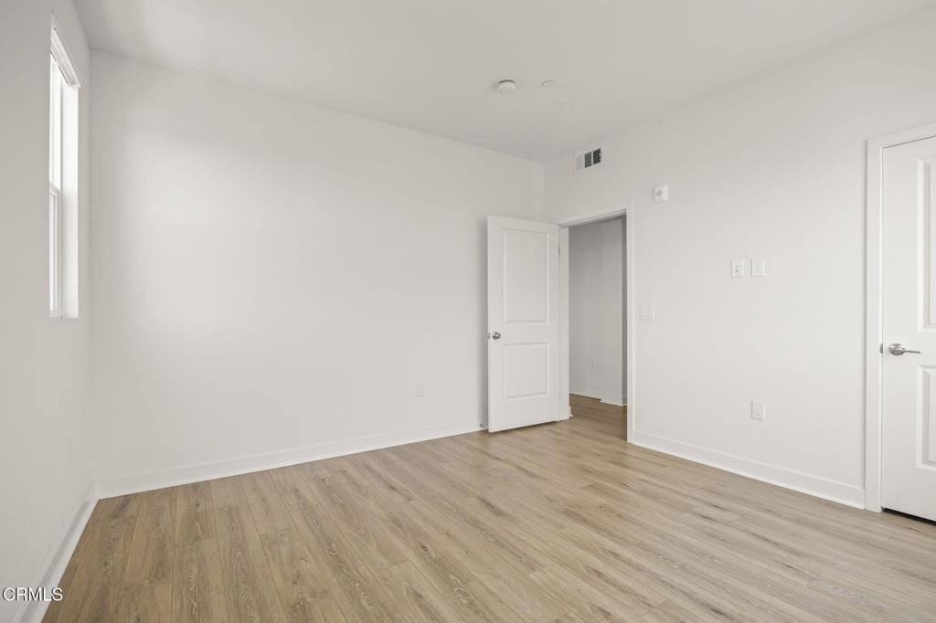 2870 Wagon Wheel Road, Unit 401 Oxnard, CA 93036 - Photo 24 of 49 a view of an empty room with wooden floor