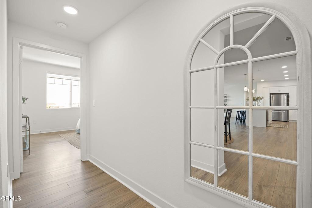 2870 Wagon Wheel Road, Unit 401 Oxnard, CA 93036 - Photo 26 of 49 an empty room with wooden floor and white walls