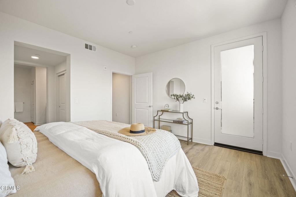 2870 Wagon Wheel Road, Unit 401 Oxnard, CA 93036 - Photo 28 of 49 a bedroom with a bed and a table