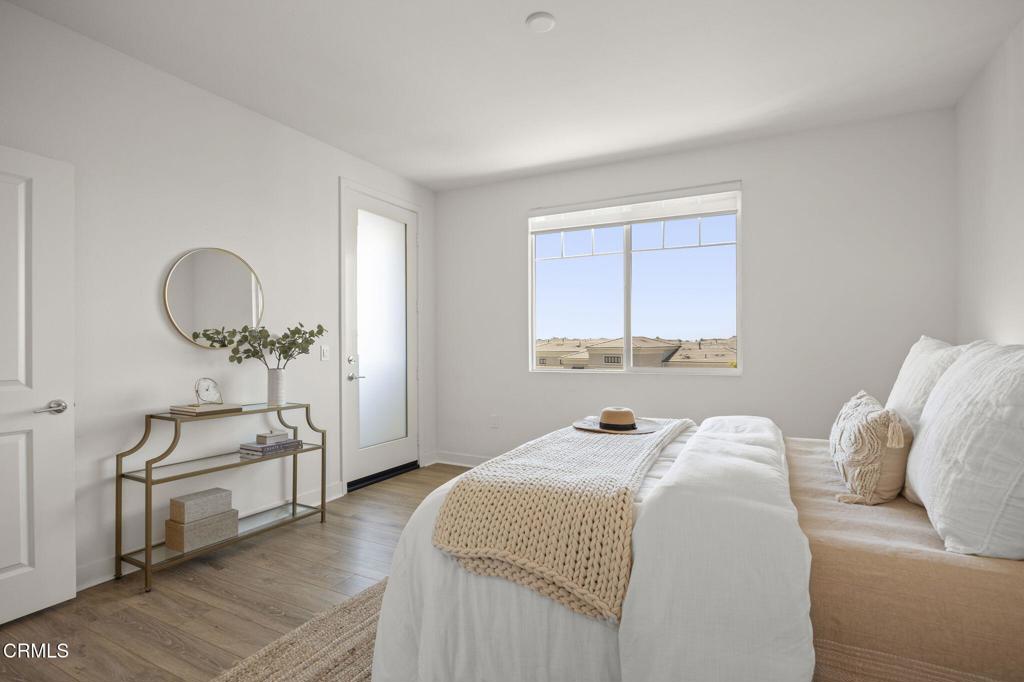 2870 Wagon Wheel Road, Unit 401 Oxnard, CA 93036 - Photo 30 of 49 a bedroom with a bed and a window