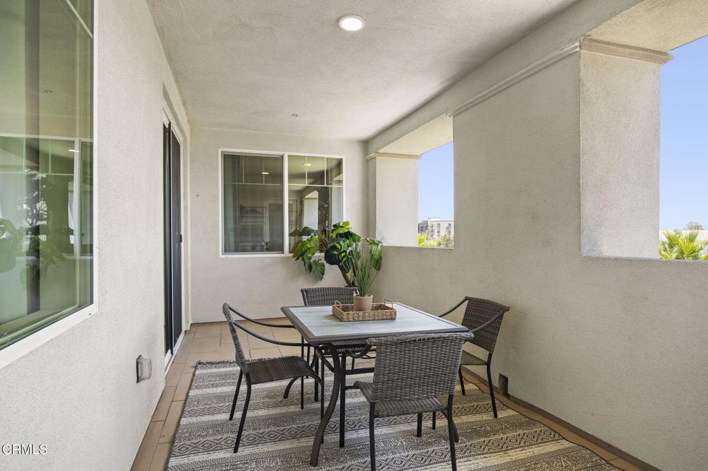 2870 Wagon Wheel Road, Unit 401 Oxnard, CA 93036 - Photo 3 of 49 a view of a dining room with furniture and window