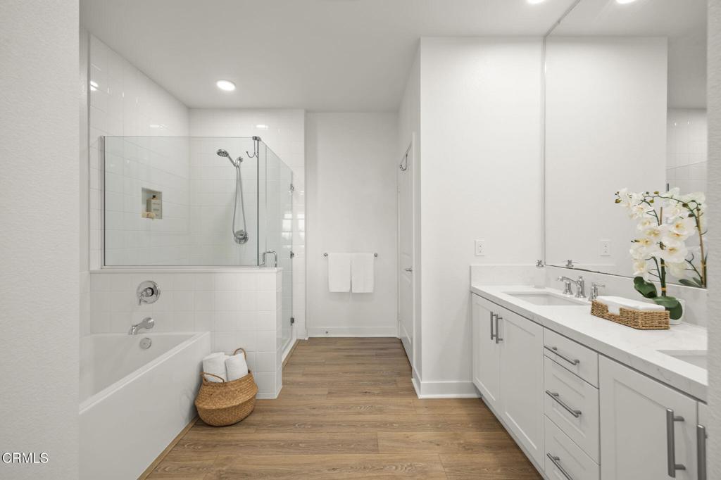 2870 Wagon Wheel Road, Unit 401 Oxnard, CA 93036 - Photo 32 of 49 a spacious bathroom with a tub sink and mirror