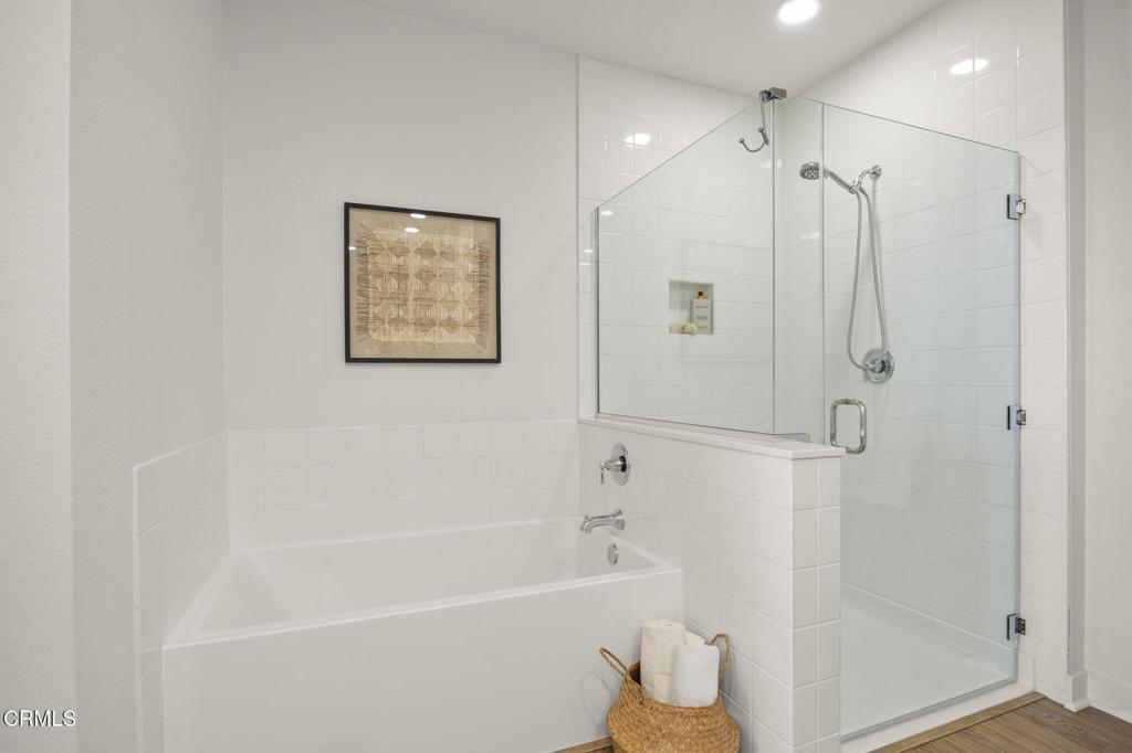 2870 Wagon Wheel Road, Unit 401 Oxnard, CA 93036 - Photo 34 of 49 a bathroom with a shower and a bath tub