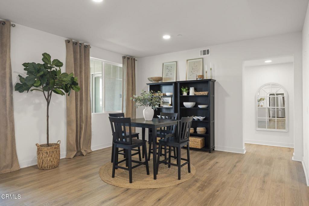 2870 Wagon Wheel Road, Unit 401 Oxnard, CA 93036 - Photo 10 of 49 a view of a dining room with furniture and window