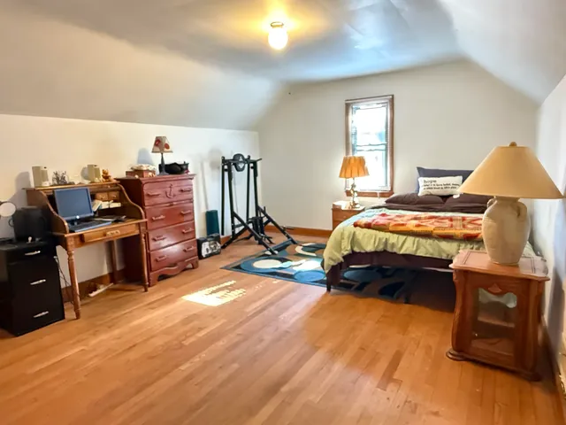 a bedroom with bed and window