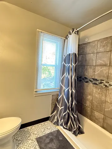 a room with gym equipment and windows