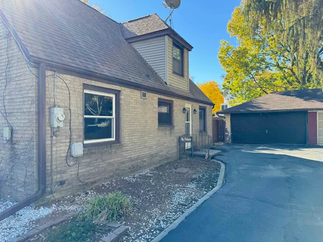 a house view with a backyard space