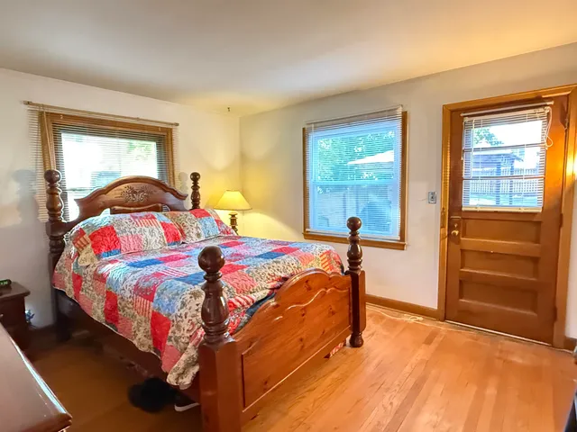 a bedroom with a bed and a closet
