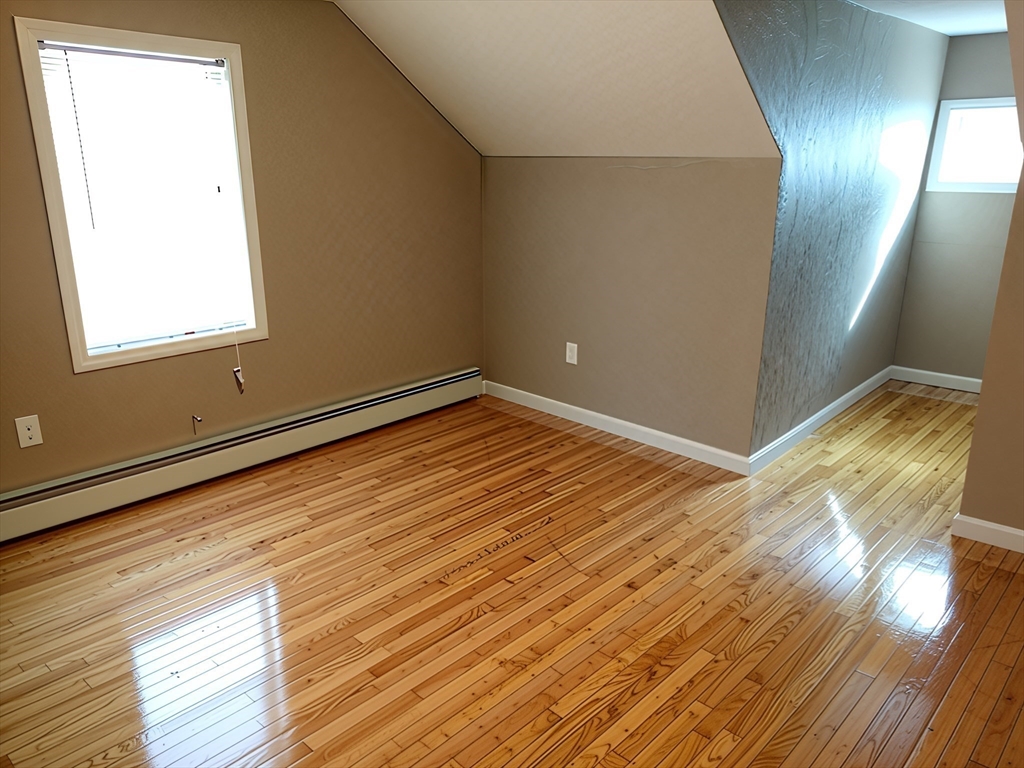 84 Cross Street Somerville, MA 02145 - Photo 31 of 42 a view of empty room with wooden floor