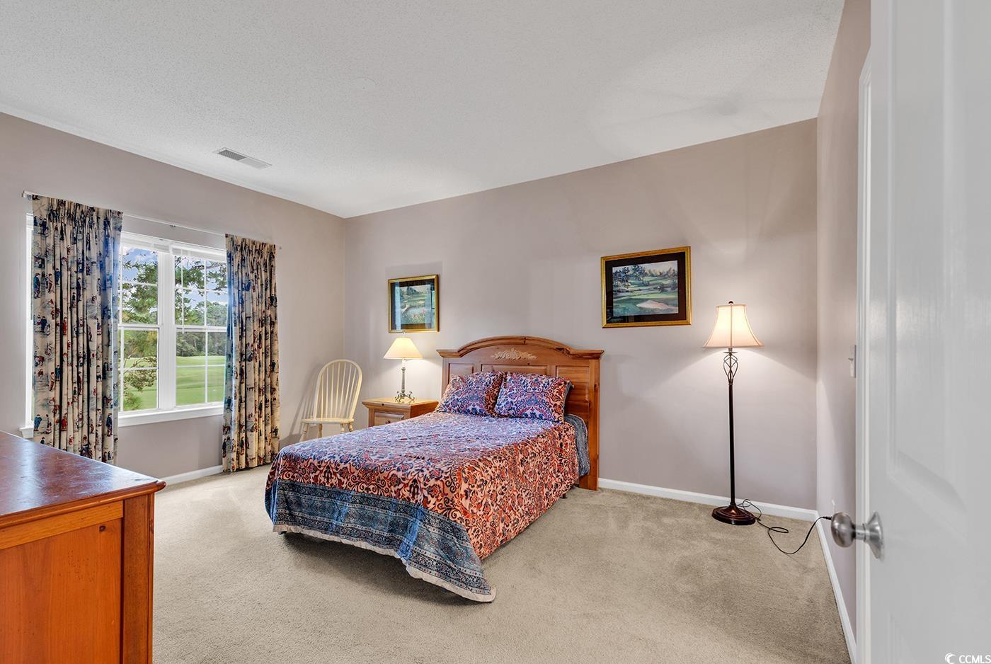 4608 Arran Court, Unit E Myrtle Beach, SC 29579 - Photo 12 of 39 Kitchen with a textured ceiling, light hardwood /
