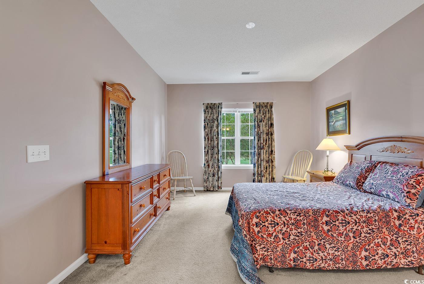 4608 Arran Court, Unit E Myrtle Beach, SC 29579 - Photo 14 of 39 Carpeted bedroom featuring connected bathroom