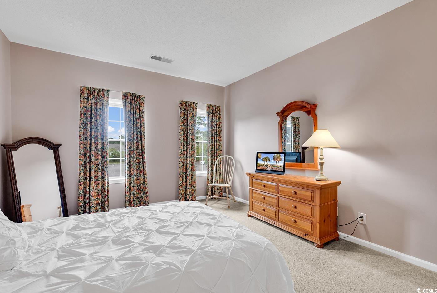 4608 Arran Court, Unit E Myrtle Beach, SC 29579 - Photo 18 of 39 Bedroom with light carpet