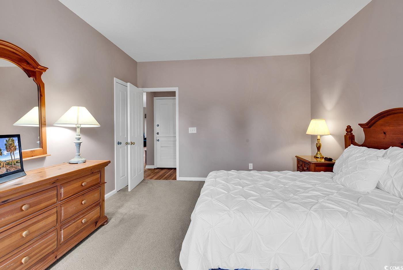 4608 Arran Court, Unit E Myrtle Beach, SC 29579 - Photo 20 of 39 Bedroom featuring light colored carpet