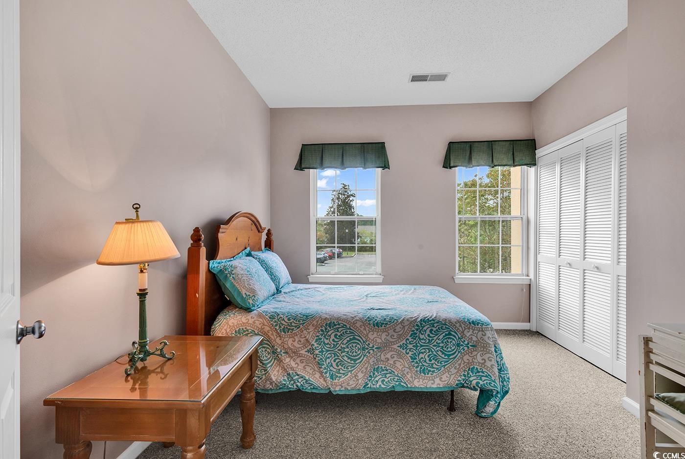 4608 Arran Court, Unit E Myrtle Beach, SC 29579 - Photo 22 of 39 Full bathroom with combined bath / shower with gla
