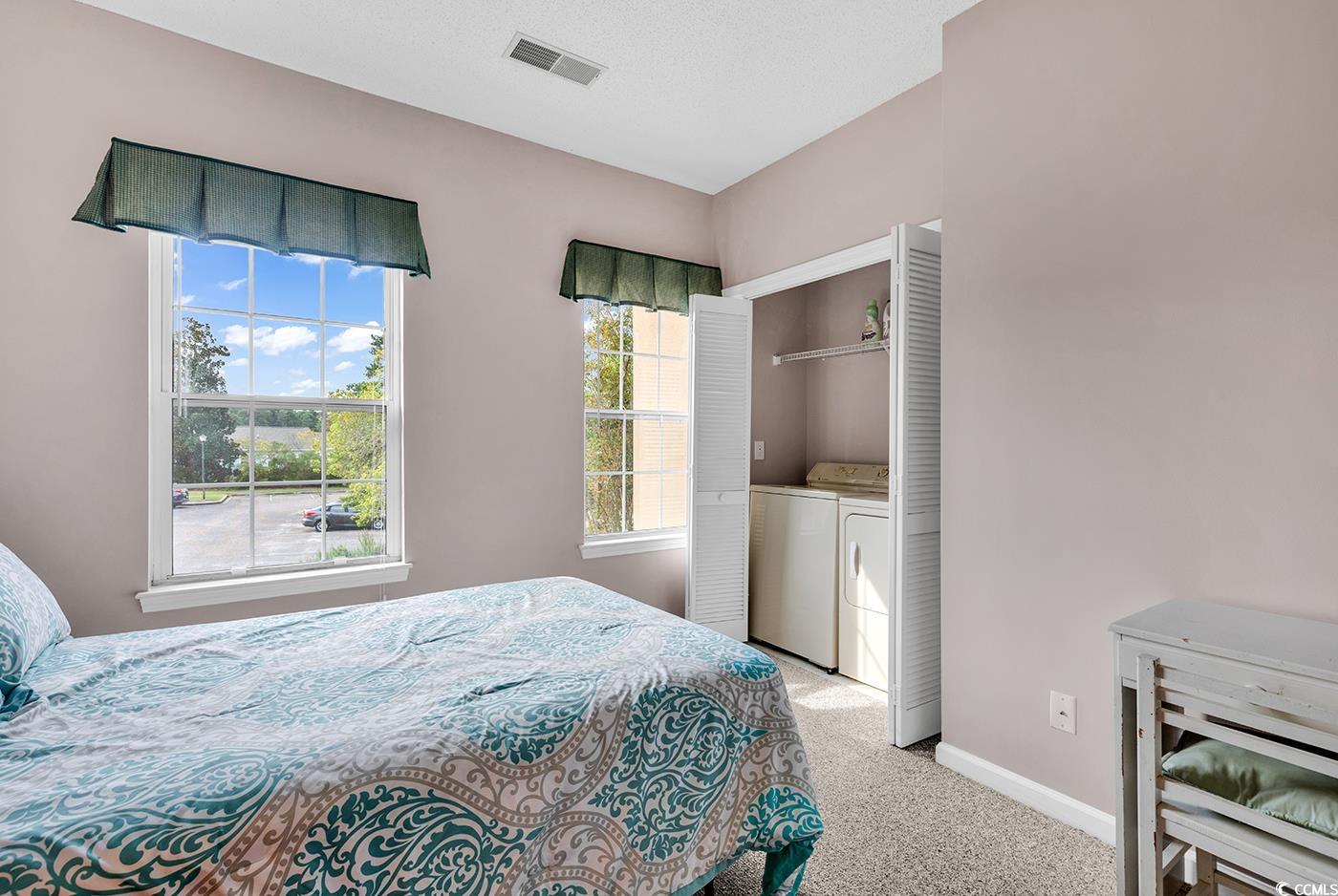 4608 Arran Court, Unit E Myrtle Beach, SC 29579 - Photo 23 of 39 Bedroom with a textured ceiling, carpet flooring,