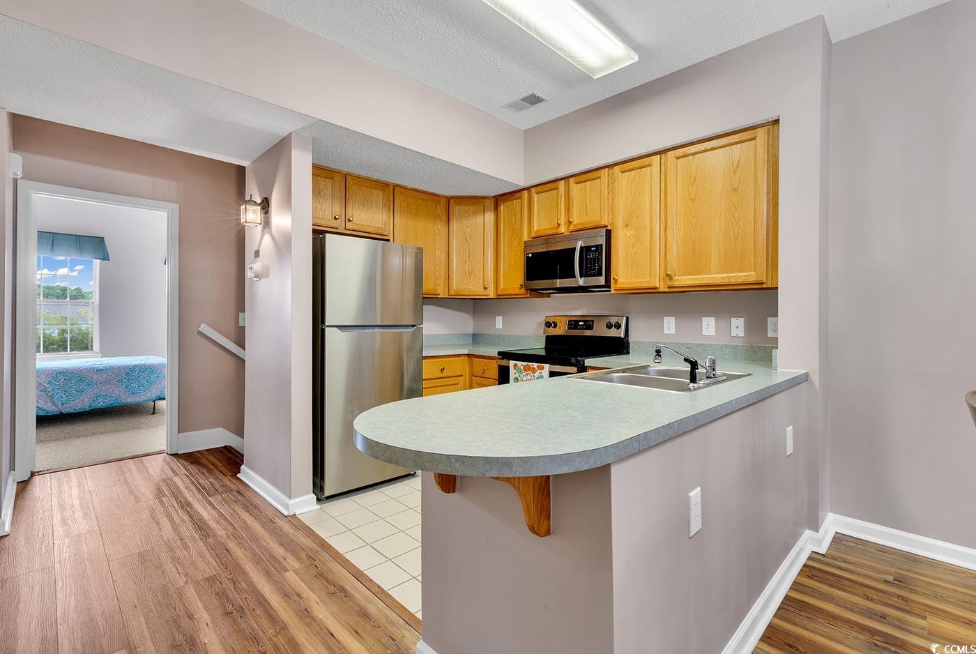 4608 Arran Court, Unit E Myrtle Beach, SC 29579 - Photo 4 of 39 Kitchen with stainless steel appliances, a texture