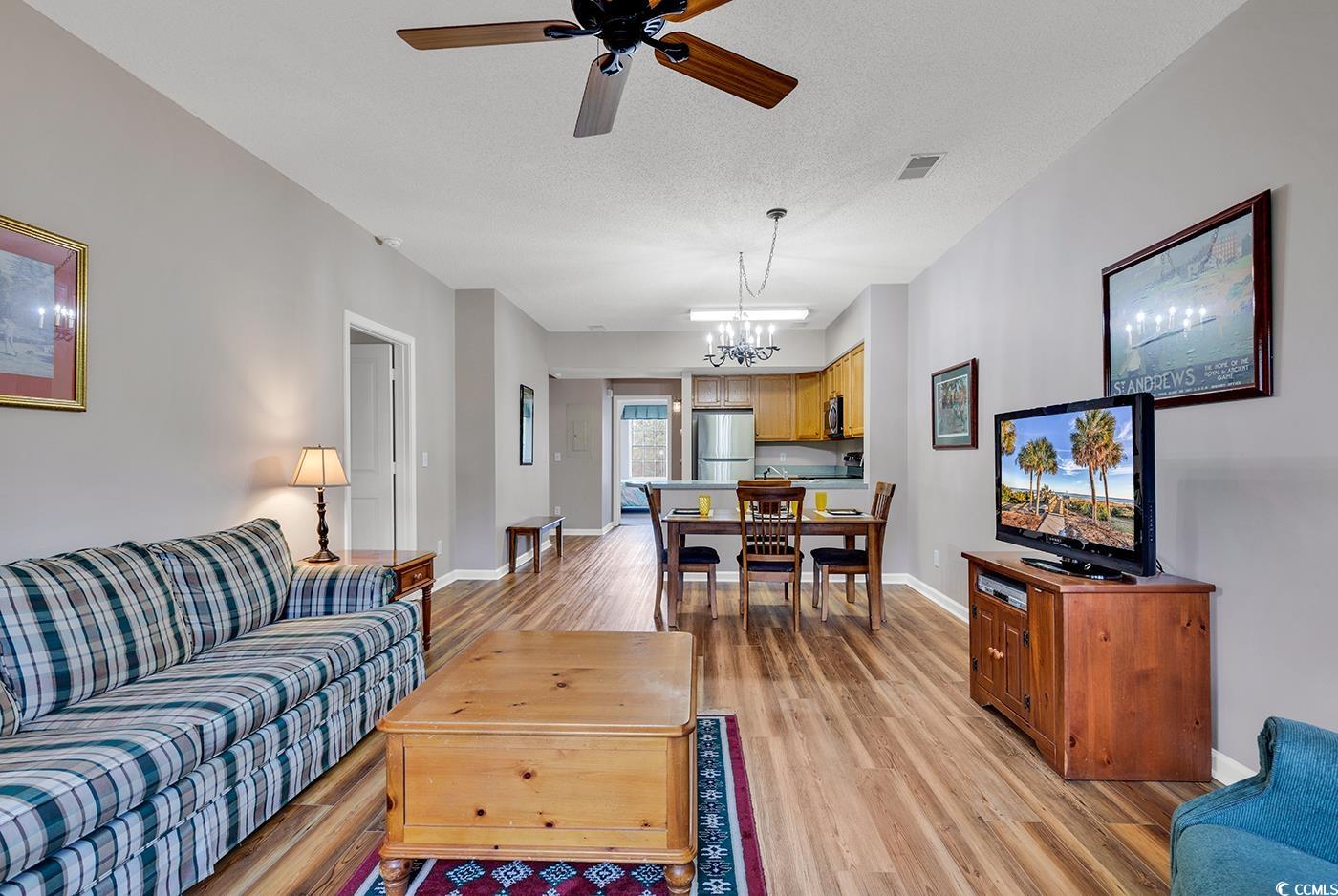 4608 Arran Court, Unit E Myrtle Beach, SC 29579 - Photo 8 of 39 Living room featuring a textured ceiling, ceiling