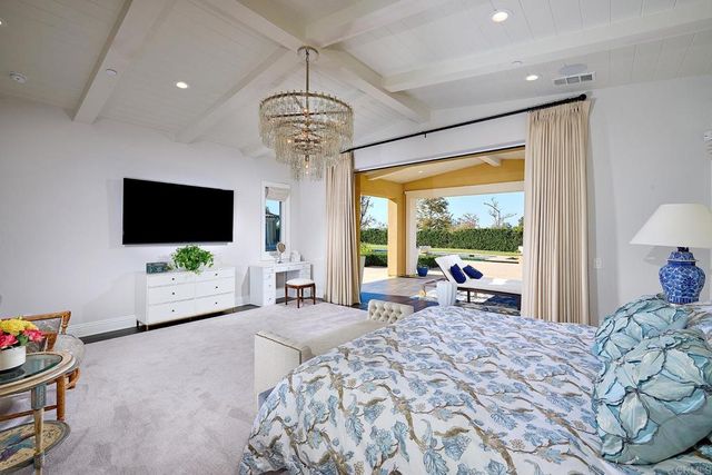 a view of a livingroom with furniture window and a flat screen tv