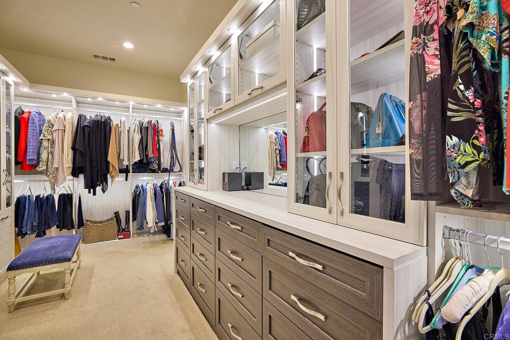 15527 Artesian Ridge San Diego, CA 92127 - Photo 16 of 25 a view of walk in closet with clothes and shoes