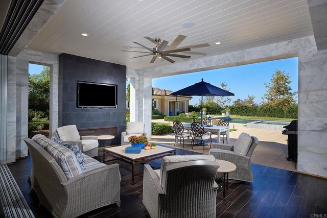 a view of a dining room with furniture window and outside view