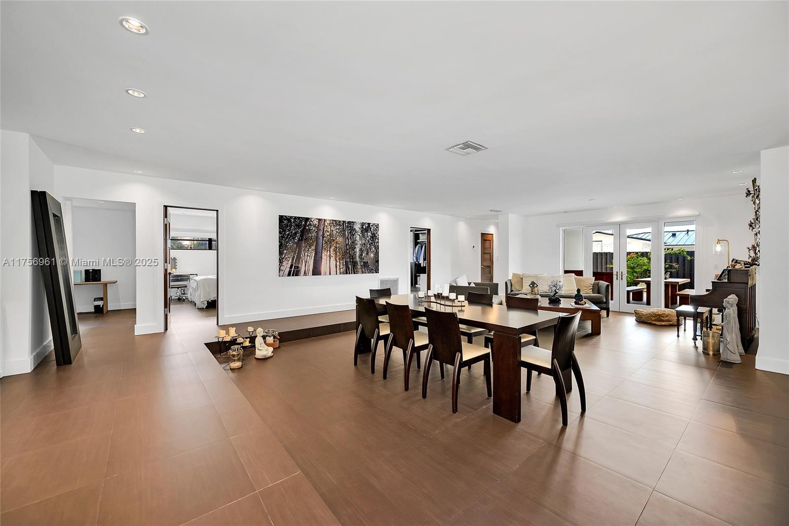 2120 Northeast 204th Street Miami, FL 33179 - Photo 13 of 52 a view of a dining room with furniture window and wooden floor