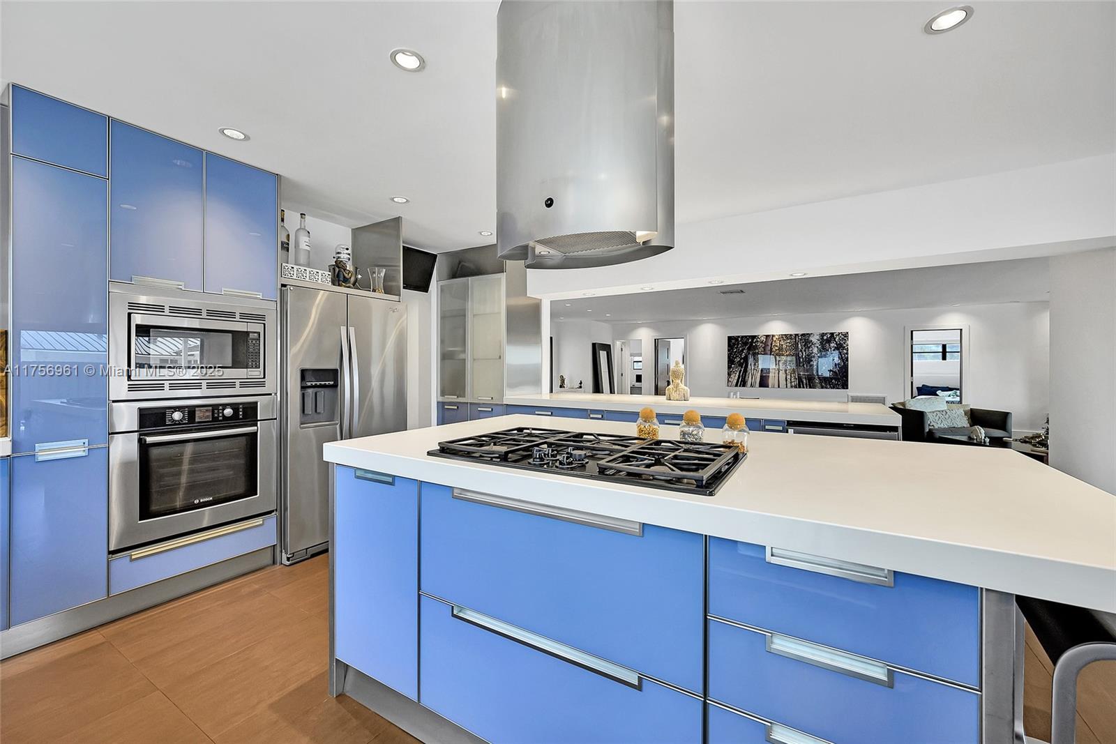 2120 Northeast 204th Street Miami, FL 33179 - Photo 19 of 52 a kitchen with stainless steel appliances a stove a refrigerator and cabinets
