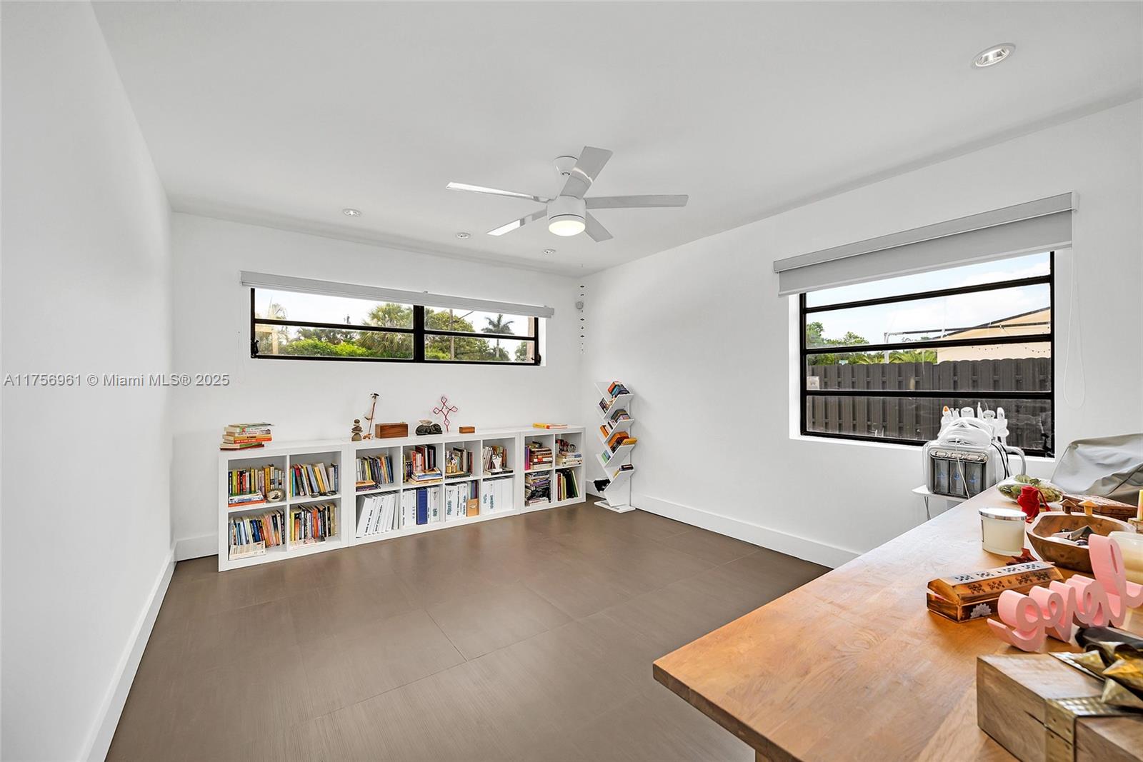 2120 Northeast 204th Street Miami, FL 33179 - Photo 24 of 52 a living room with furniture and a large window