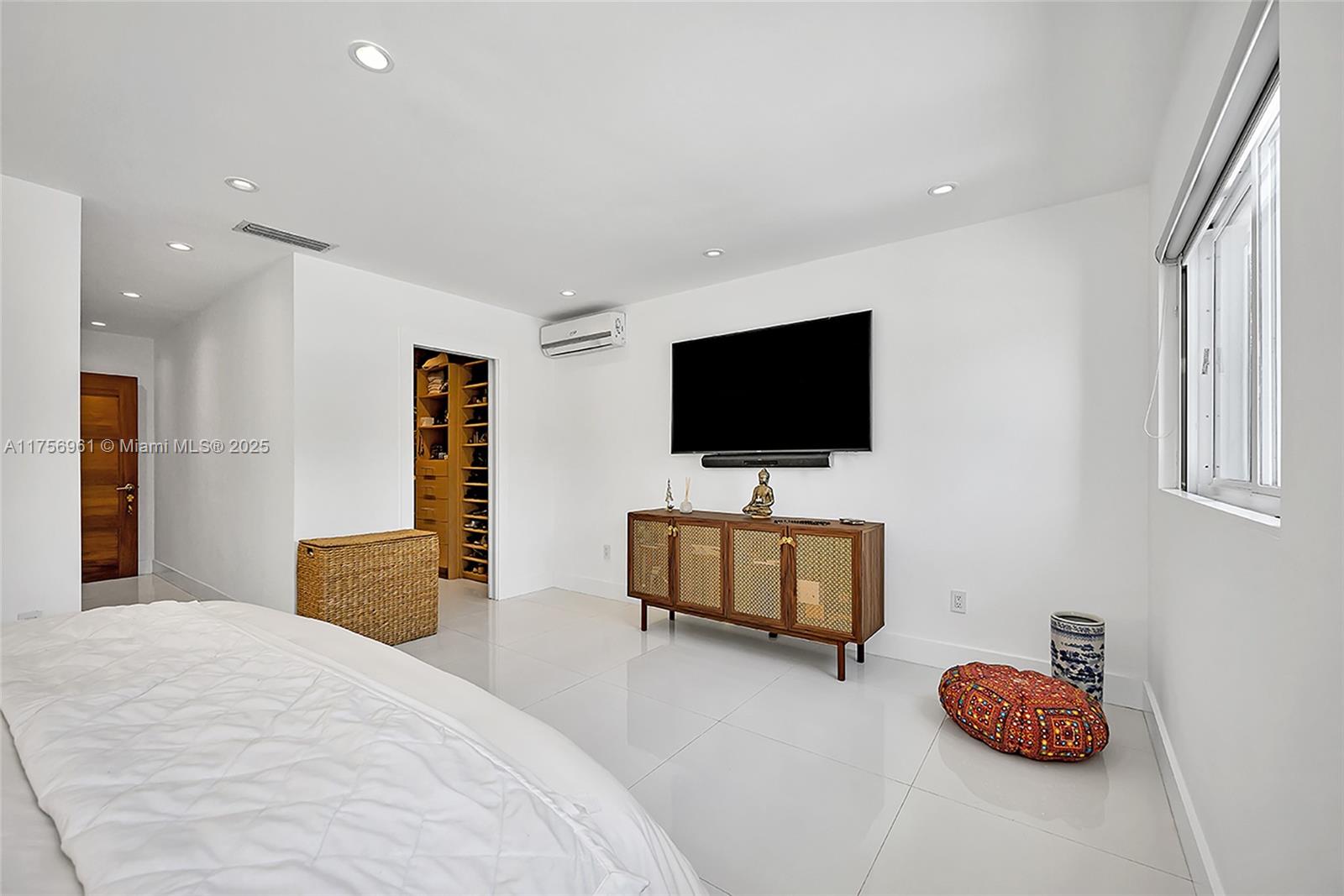 2120 Northeast 204th Street Miami, FL 33179 - Photo 34 of 52 a bedroom with furniture and flat screen tv