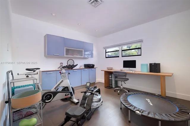 a view of a house with swimming pool and sitting area