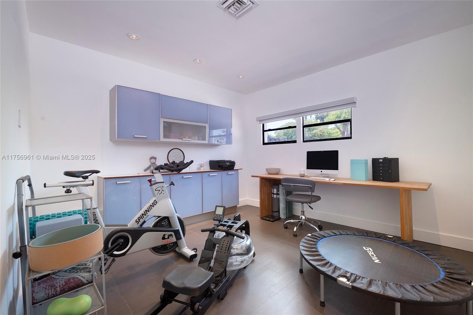 2120 Northeast 204th Street Miami, FL 33179 - Photo 37 of 52 a view of a workspace with furniture and a window