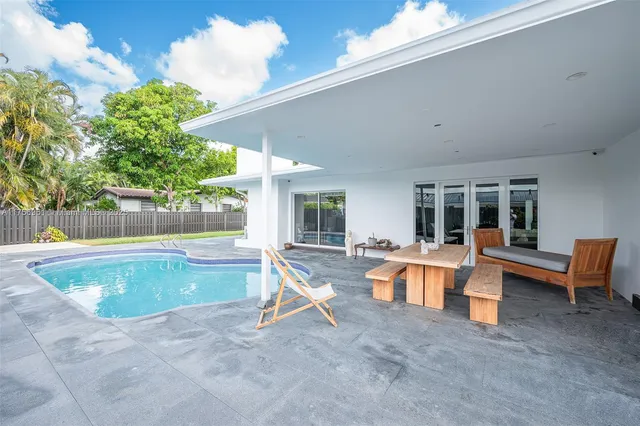 a view of house with yard and entertaining space