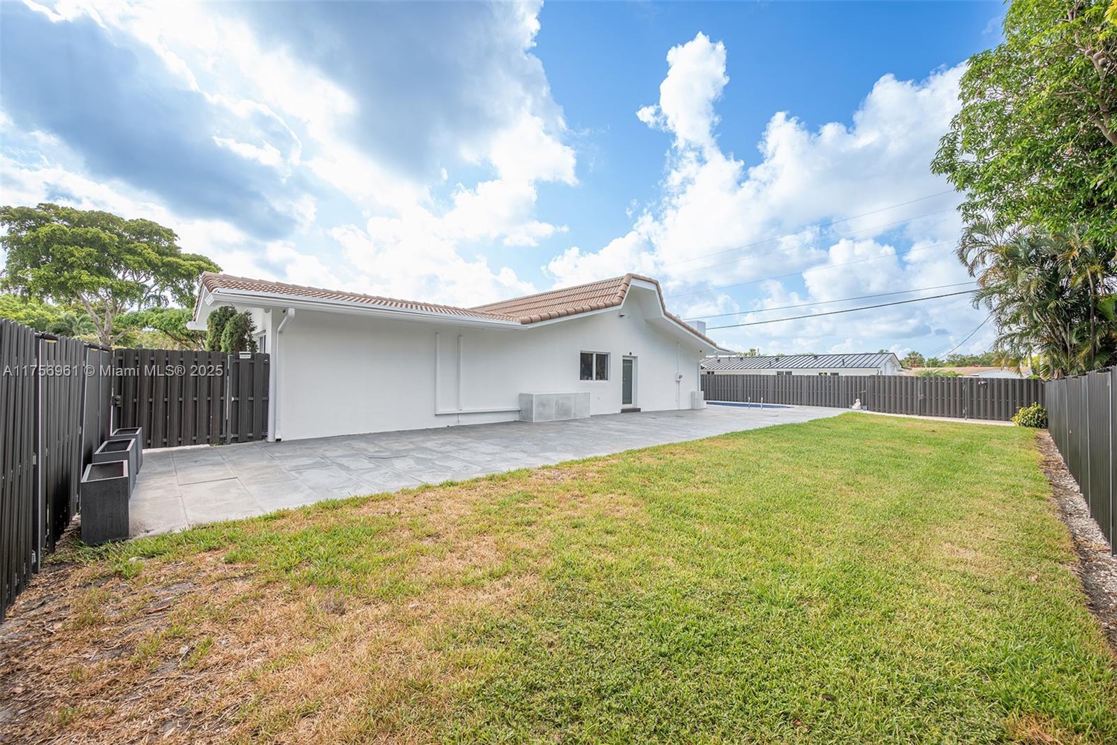 2120 Northeast 204th Street Miami, FL 33179 - Photo 45 of 52 a view of backyard of house with green space