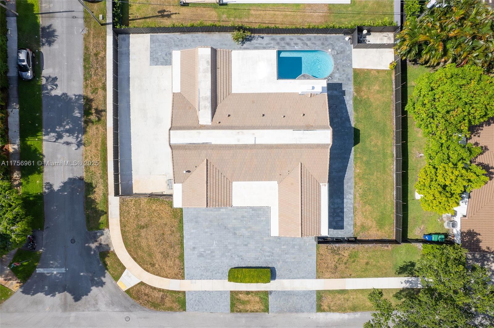 2120 Northeast 204th Street Miami, FL 33179 - Photo 46 of 52 an aerial view of a house with swimming pool