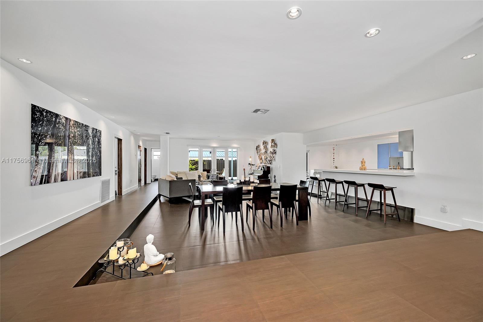 2120 Northeast 204th Street Miami, FL 33179 - Photo 7 of 52 a dining room with furniture and wooden floor