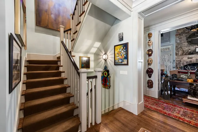 a kitchen with granite countertop a sink a stove and cabinets