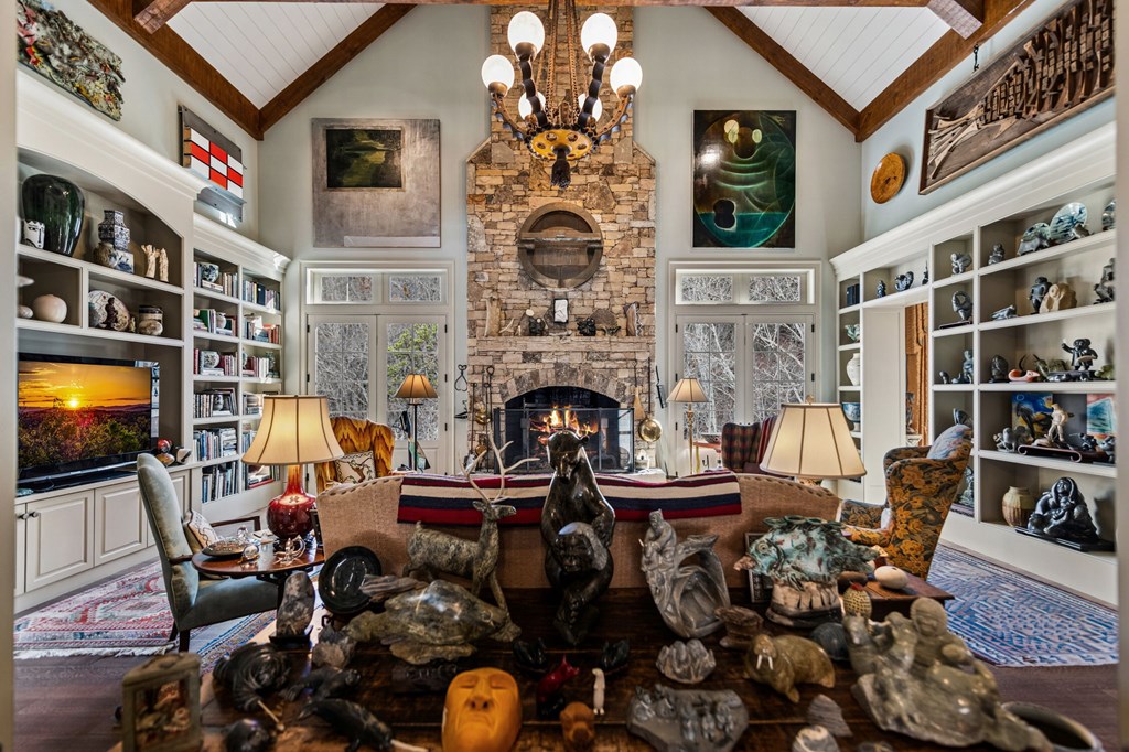 490 Red Wolf Run Franklin, NC 28734 - Photo 20 of 83 a living room with furniture a fireplace and a flat screen tv