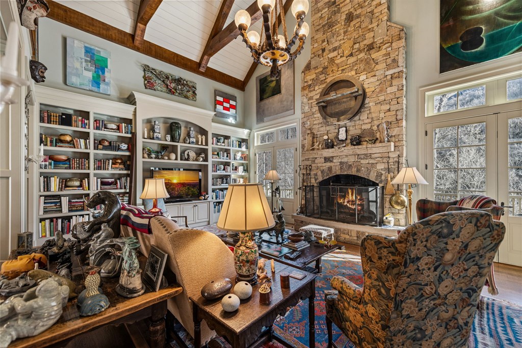 490 Red Wolf Run Franklin, NC 28734 - Photo 21 of 83 a living room with furniture a fireplace and a flat screen tv