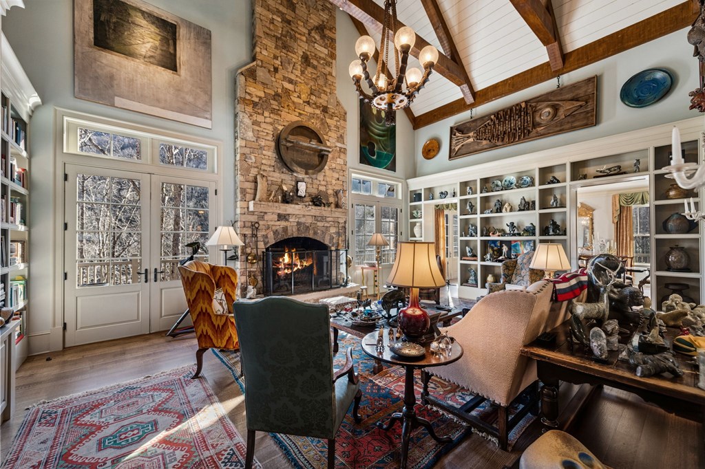 490 Red Wolf Run Franklin, NC 28734 - Photo 22 of 83 a view of a livingroom with furniture a fireplace and wooden floor