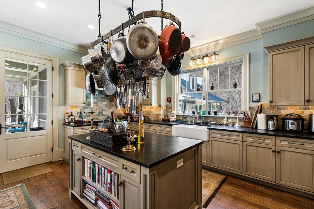 490 Red Wolf Run Franklin, NC 28734 - Photo 31 of 83 a kitchen with granite countertop a sink a stove and cabinets
