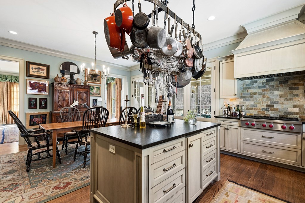 490 Red Wolf Run Franklin, NC 28734 - Photo 32 of 83 a kitchen with stainless steel appliances granite countertop a sink a stove and a wooden floors