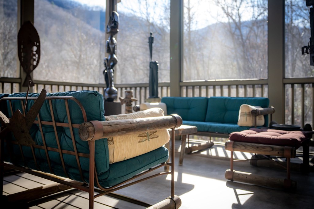 490 Red Wolf Run Franklin, NC 28734 - Photo 35 of 83 a dining room with furniture and a floor to ceiling window