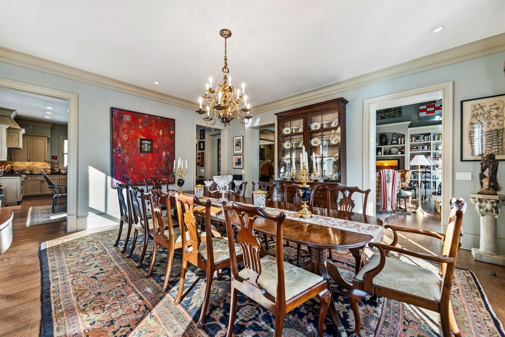 490 Red Wolf Run Franklin, NC 28734 - Photo 39 of 83 a view of a dining room with furniture wooden floor and chandelier