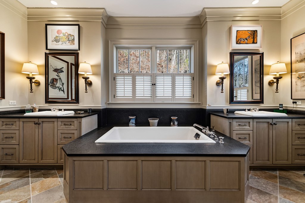 490 Red Wolf Run Franklin, NC 28734 - Photo 49 of 83 a bathroom with a sink and a mirror