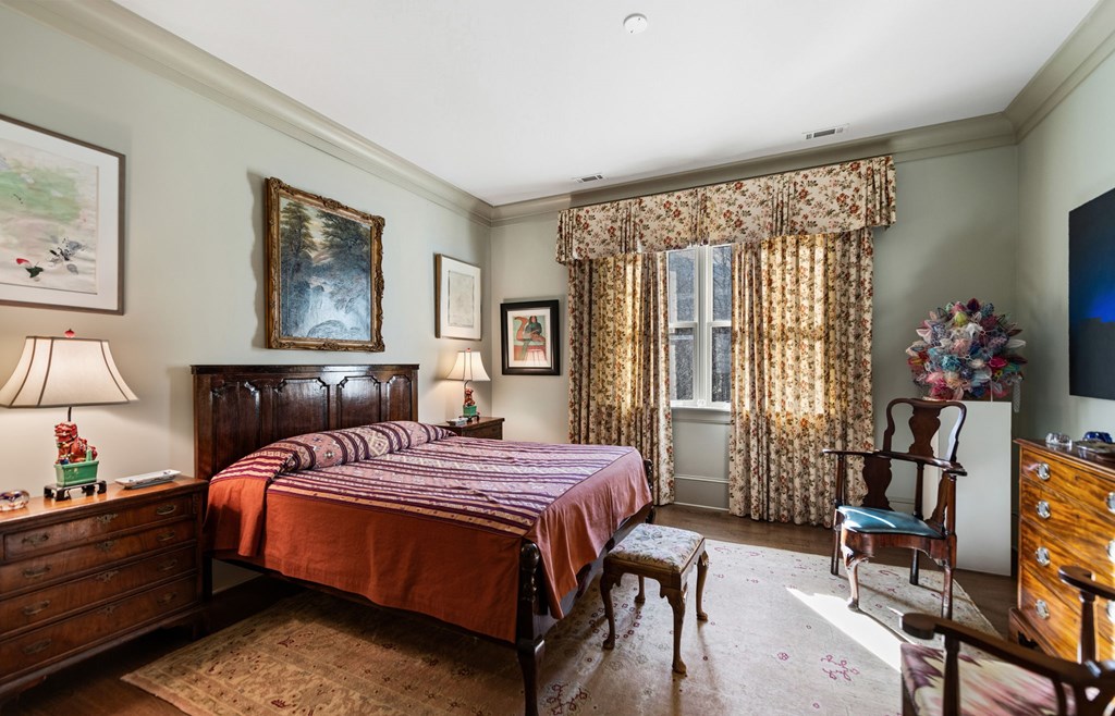 490 Red Wolf Run Franklin, NC 28734 - Photo 58 of 83 a bedroom with a bed bookshelf and a window