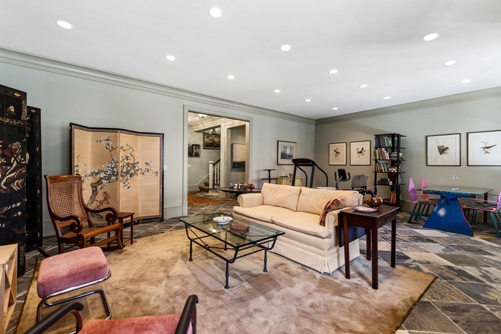 490 Red Wolf Run Franklin, NC 28734 - Photo 70 of 83 a living room with furniture a rug and a flat screen tv