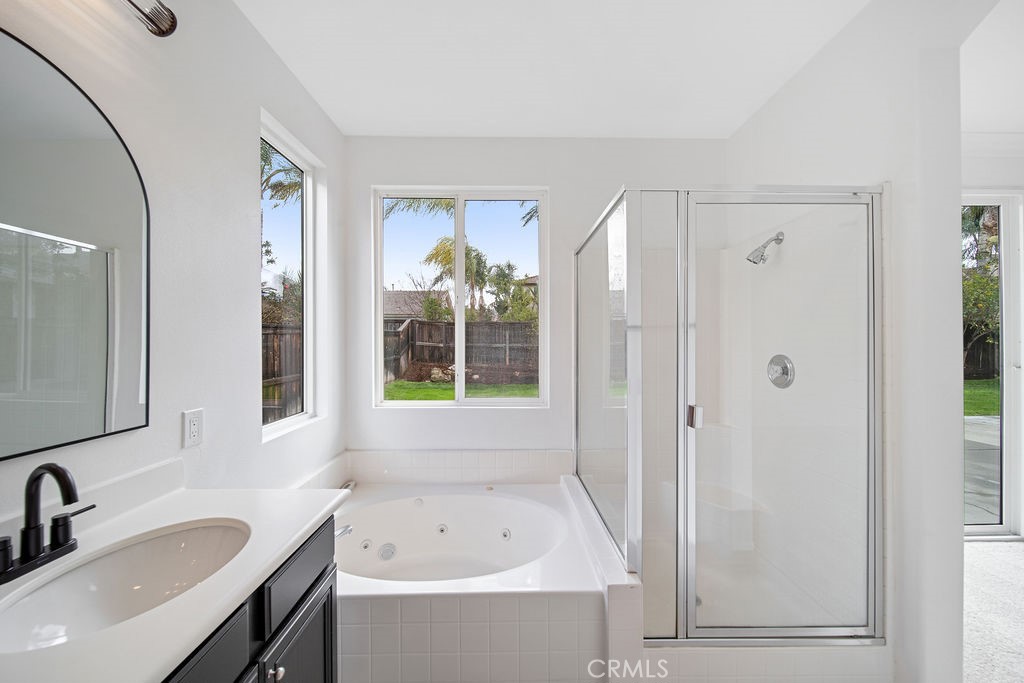 32591 Breton Drive Winchester, CA 92596 - Photo 18 of 21 a bathroom with a tub sink and mirror