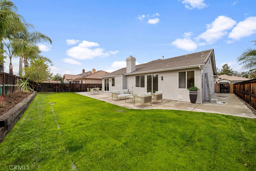 32591 Breton Drive Winchester, CA 92596 - Photo 10 of 21 a front view of a house with yard patio and fire pit