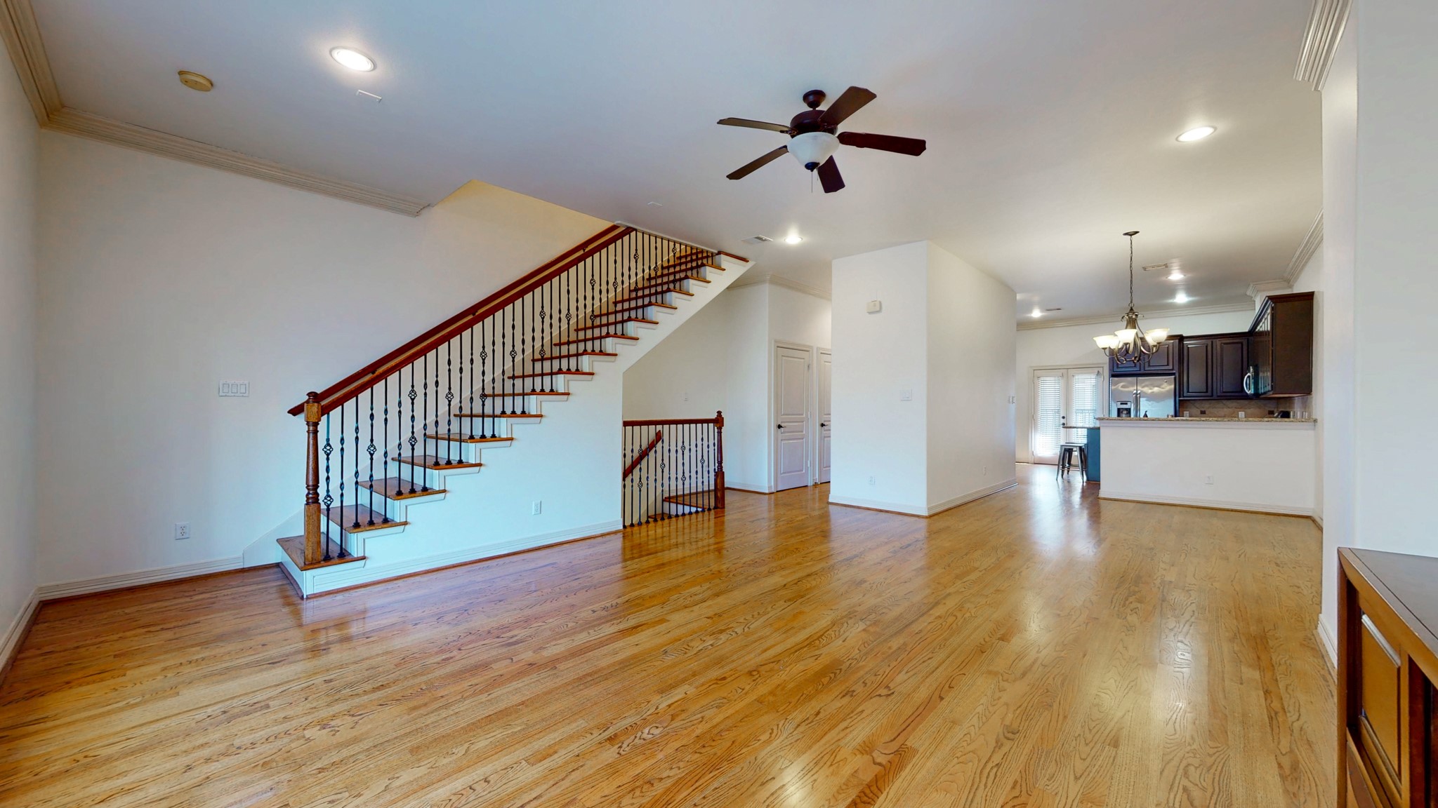 2540 Prospect Street, Unit B Houston, TX 77004 - Photo 11 of 18 a view of an entryway with wooden floor and a kitchen view