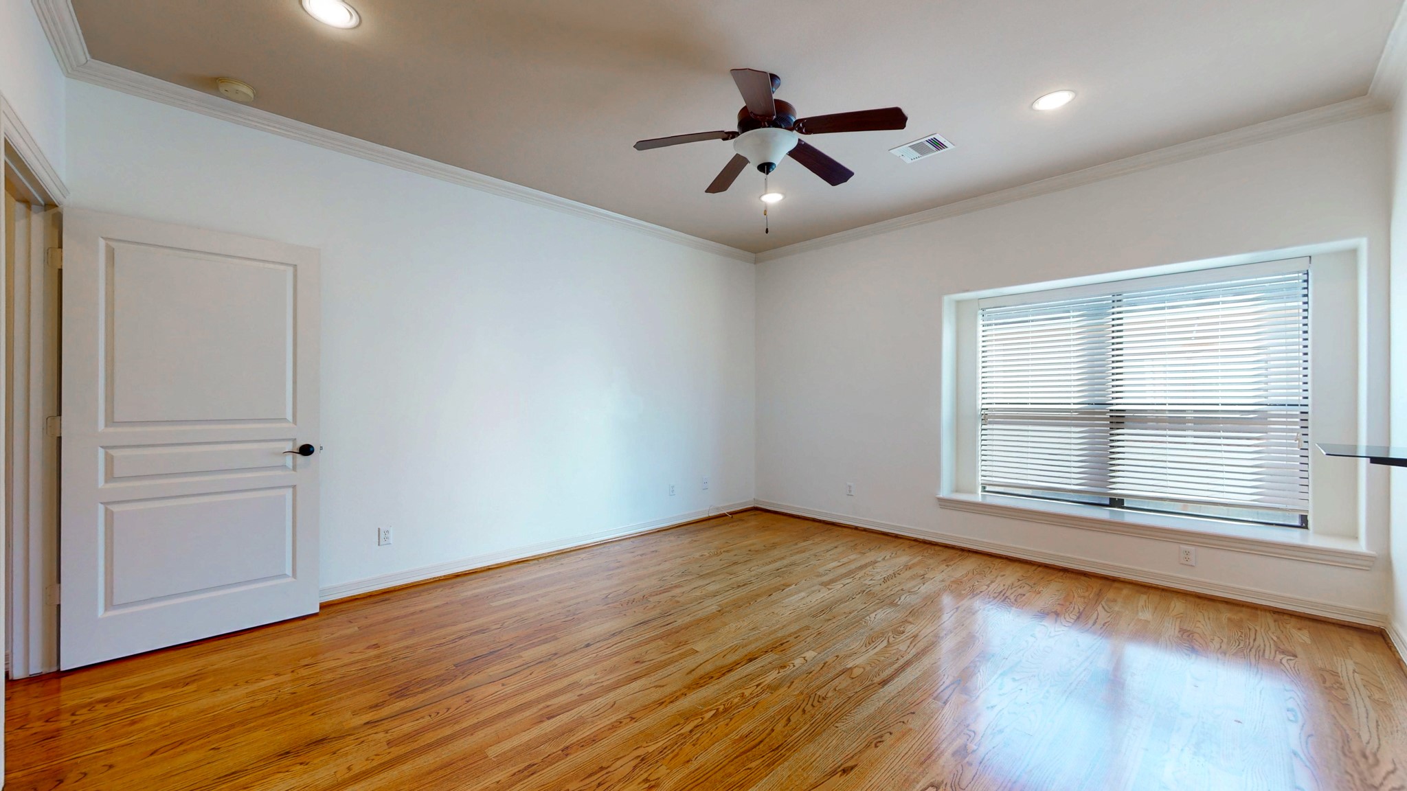 2540 Prospect Street, Unit B Houston, TX 77004 - Photo 12 of 18 a view of room window and wooden floor